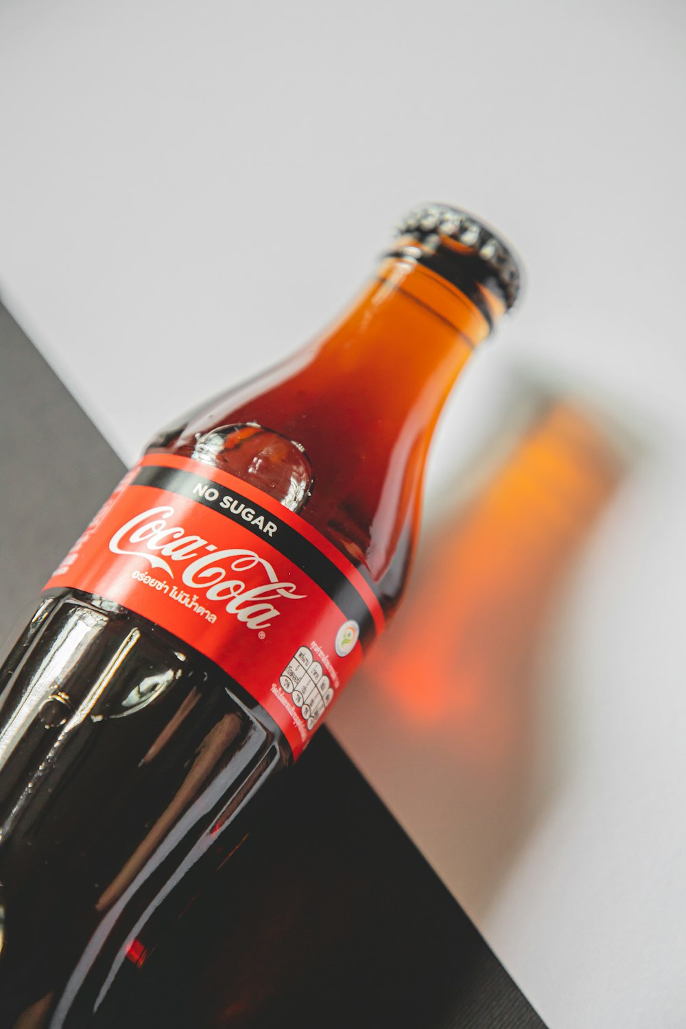 coca cola bottle on white table