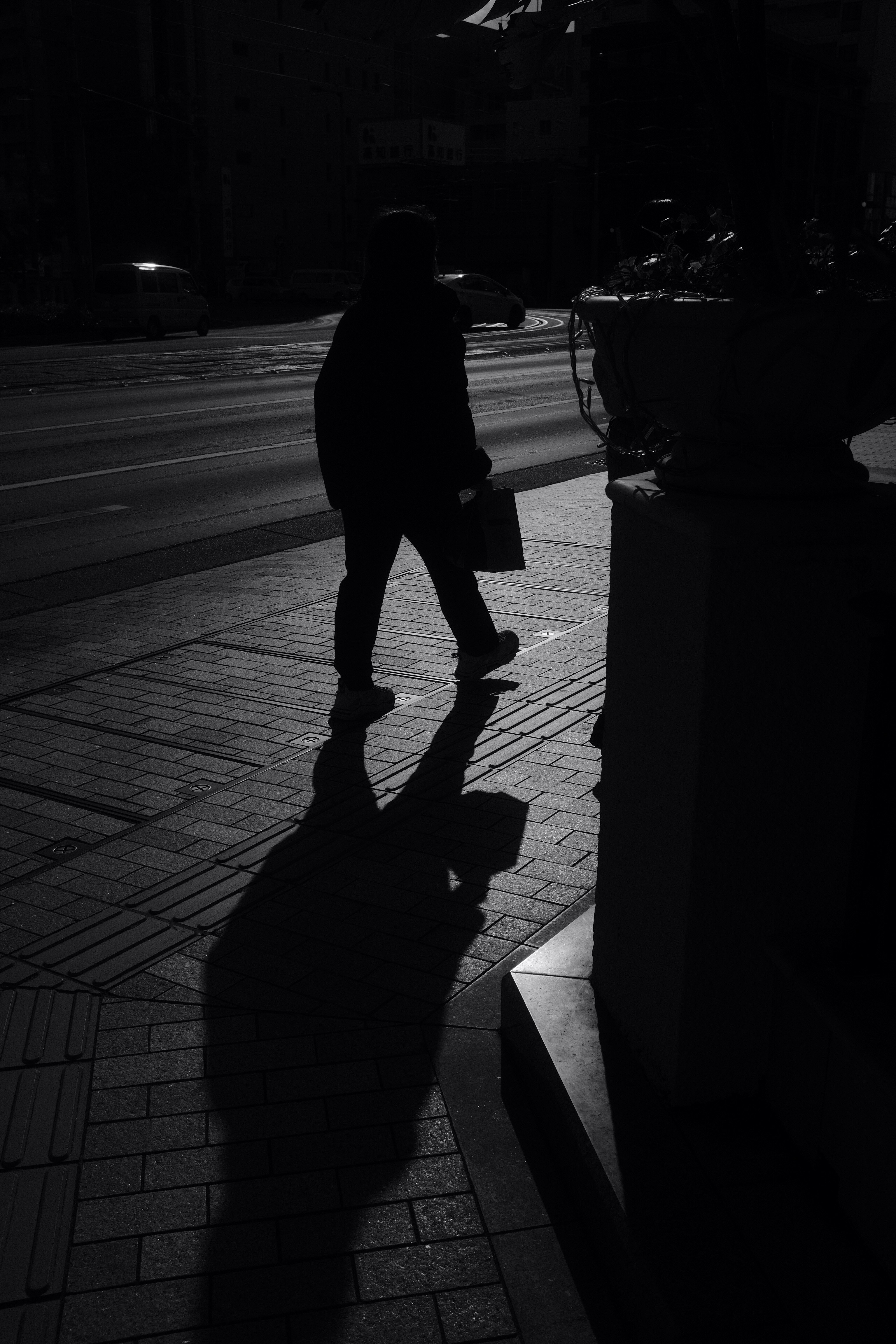 Woman in black dress walking on sidewalk during daytime photo ...