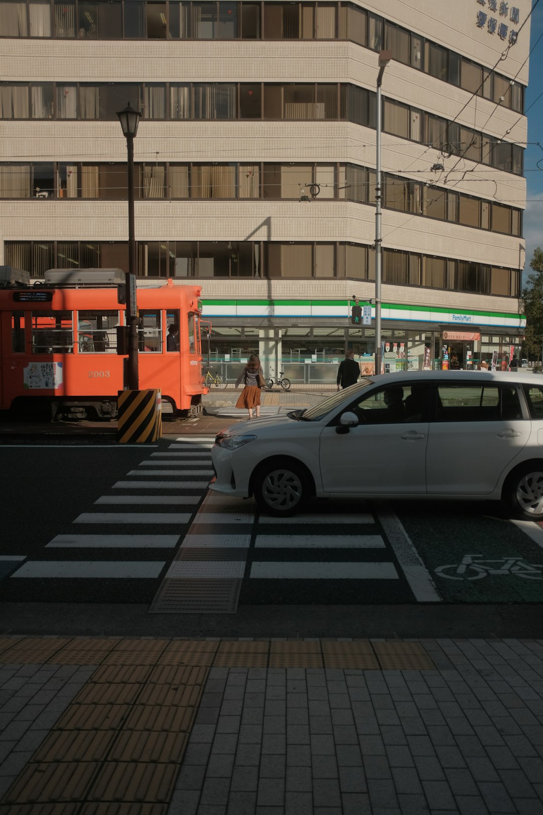 white suv on pedestrian lane during daytime