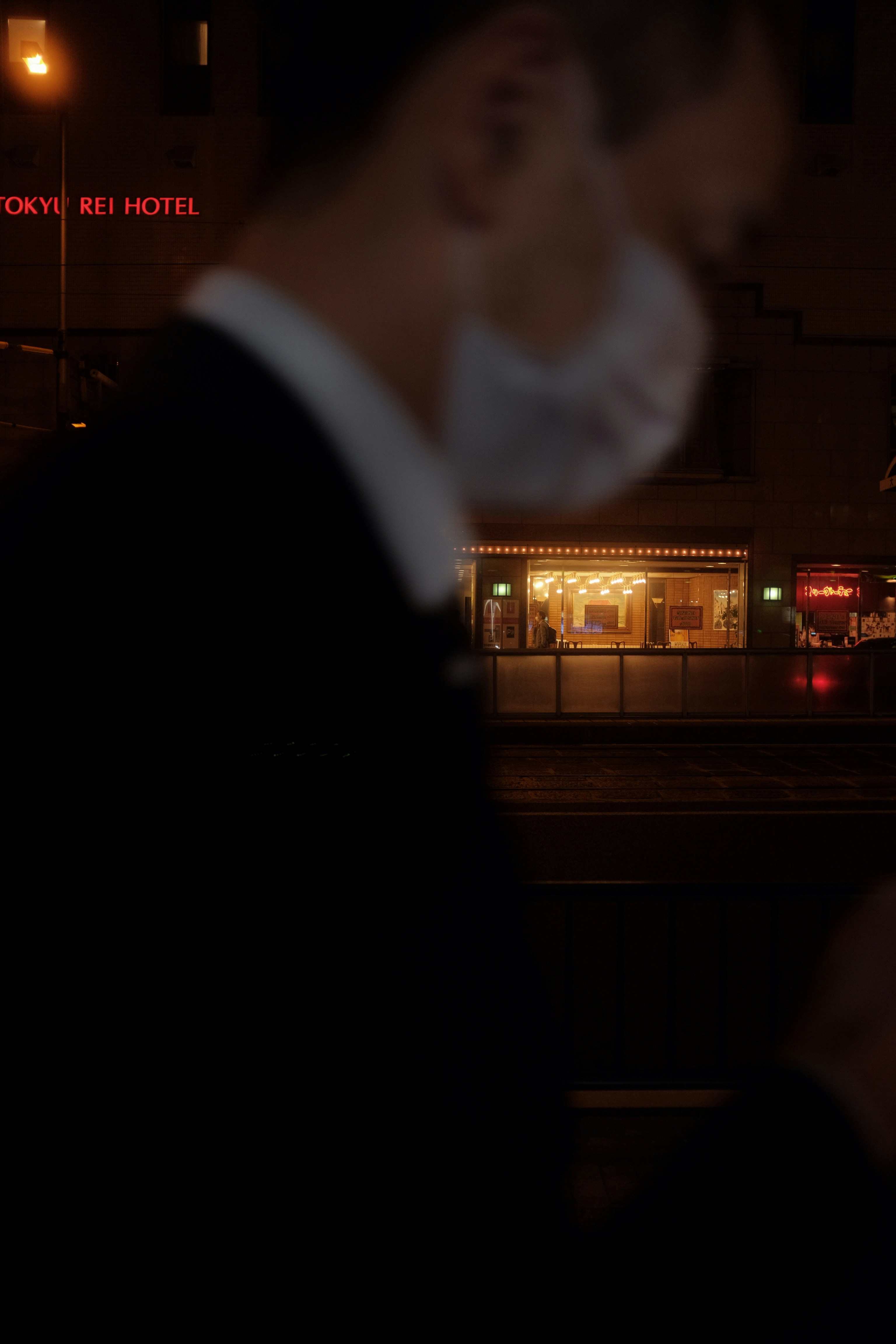 man in black suit jacket standing near man in black suit