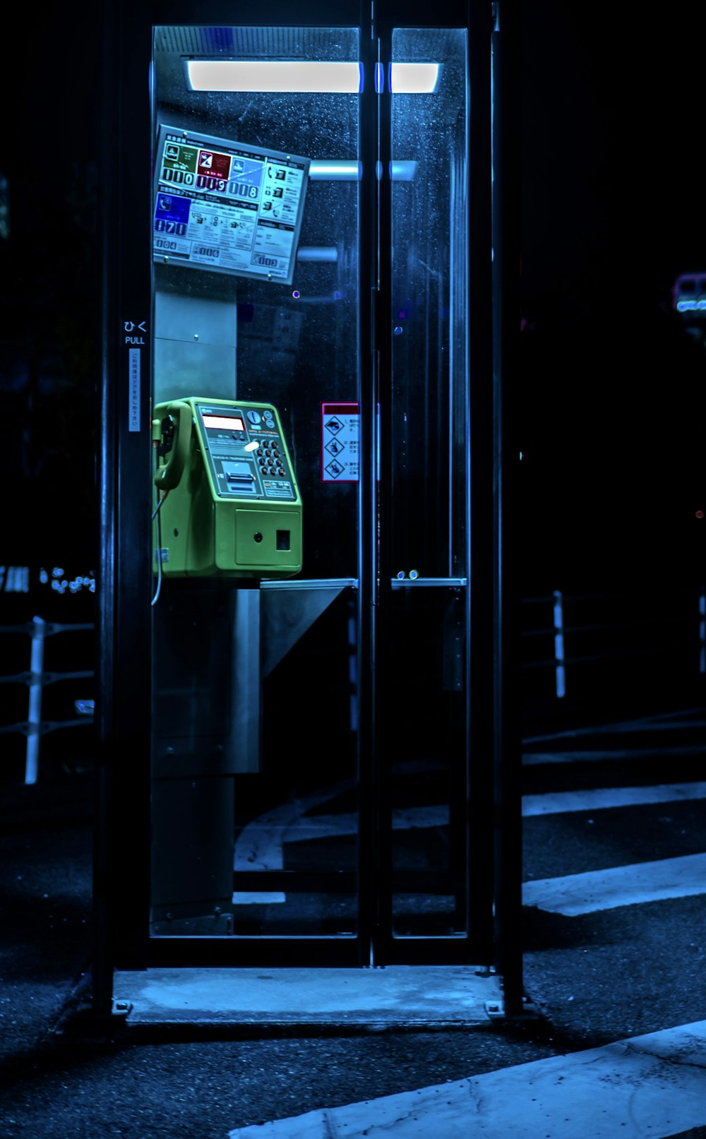 green and white telephone booth