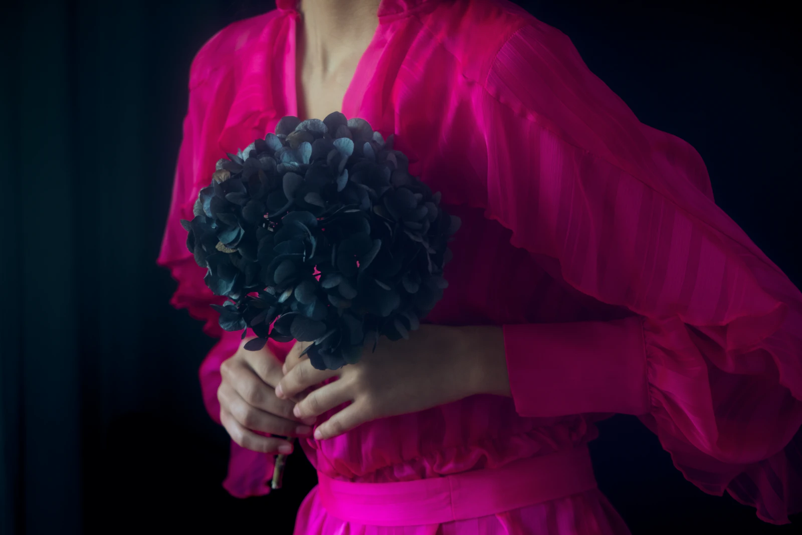 A woman in a flowing chiffon gown