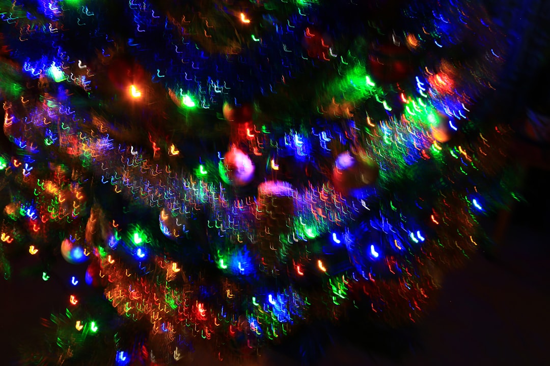 green red and blue christmas tree with string lights