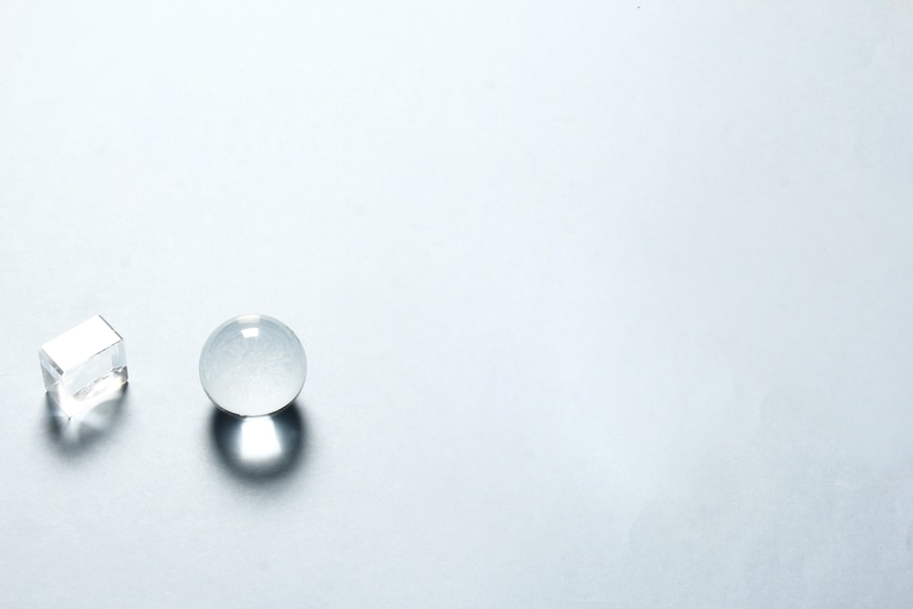 white round ornament on white surface