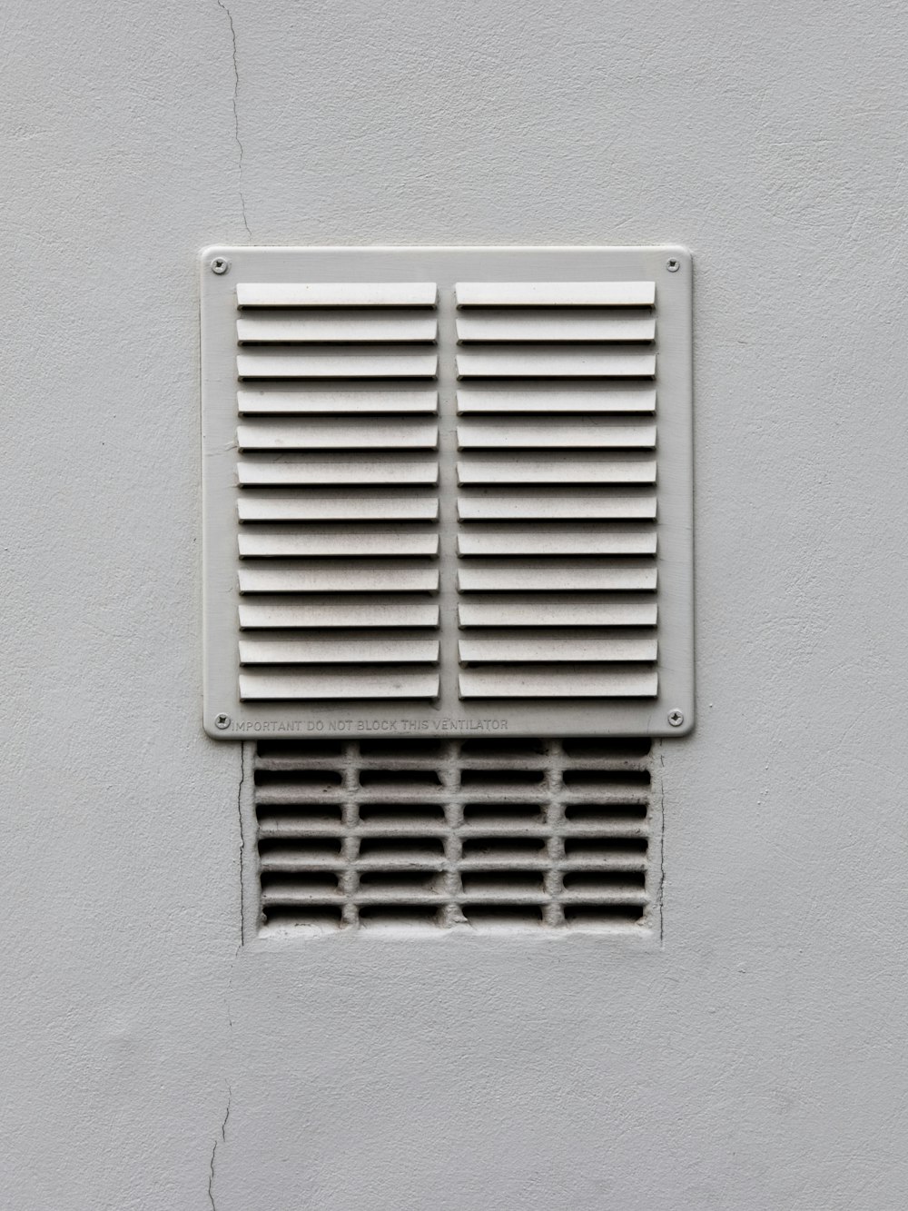 white metal window frame on white wall