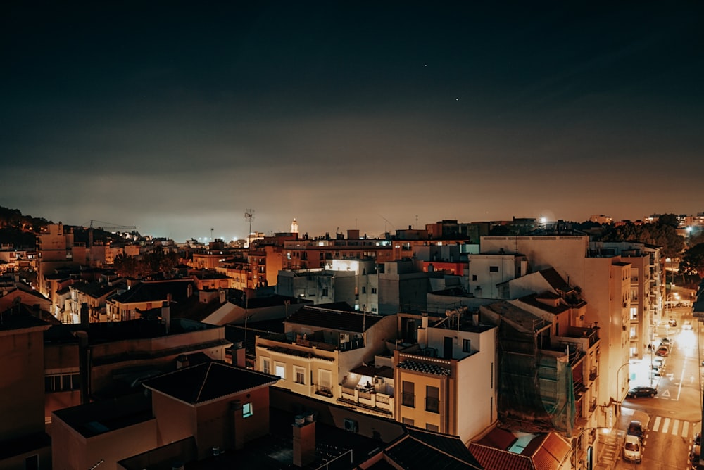 brown and white concrete buildings during night time