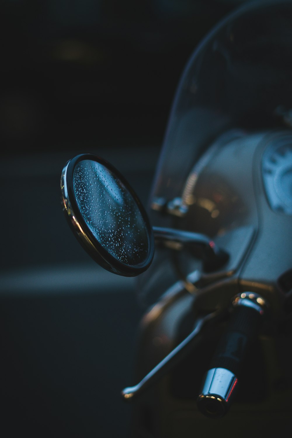 black motorcycle side mirror in grayscale photography