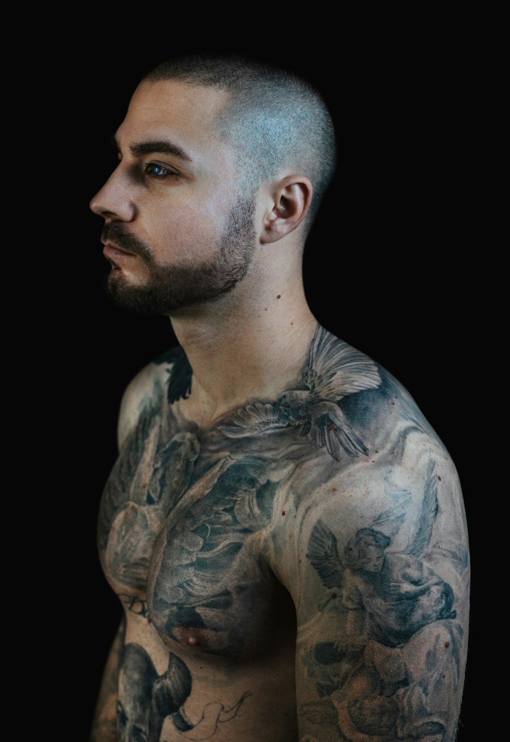 man with blue and black body tattoo