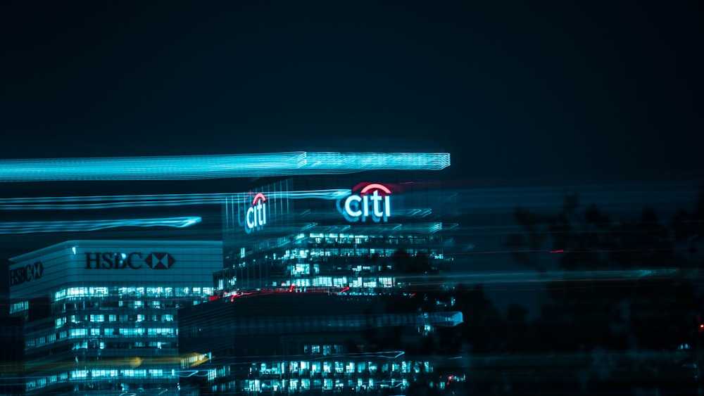 city buildings with lights during night time