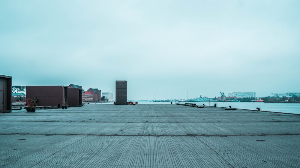 black and white concrete building near body of water during daytime