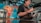 A barista skillfully preparing coffee behind the counter, surrounded by fresh ingredients.