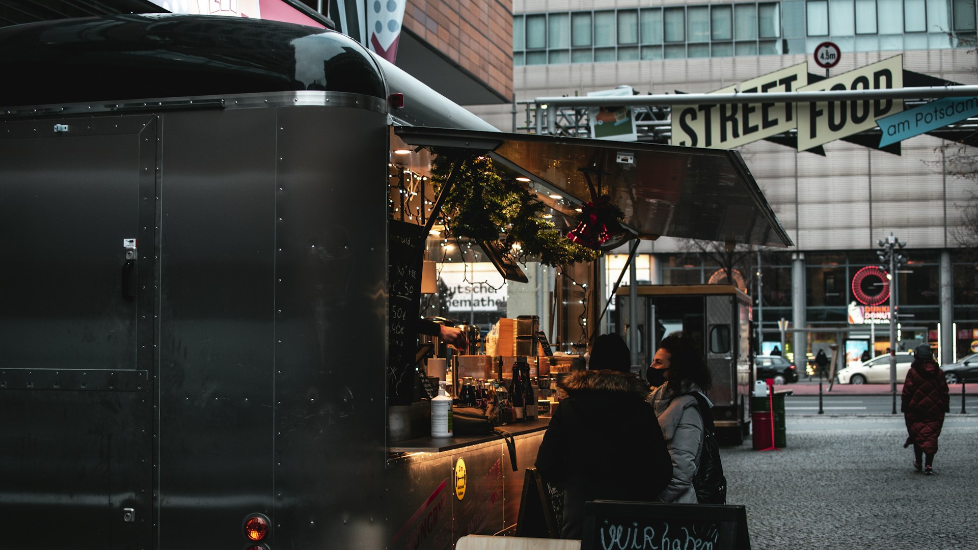 people walking on street during night time
