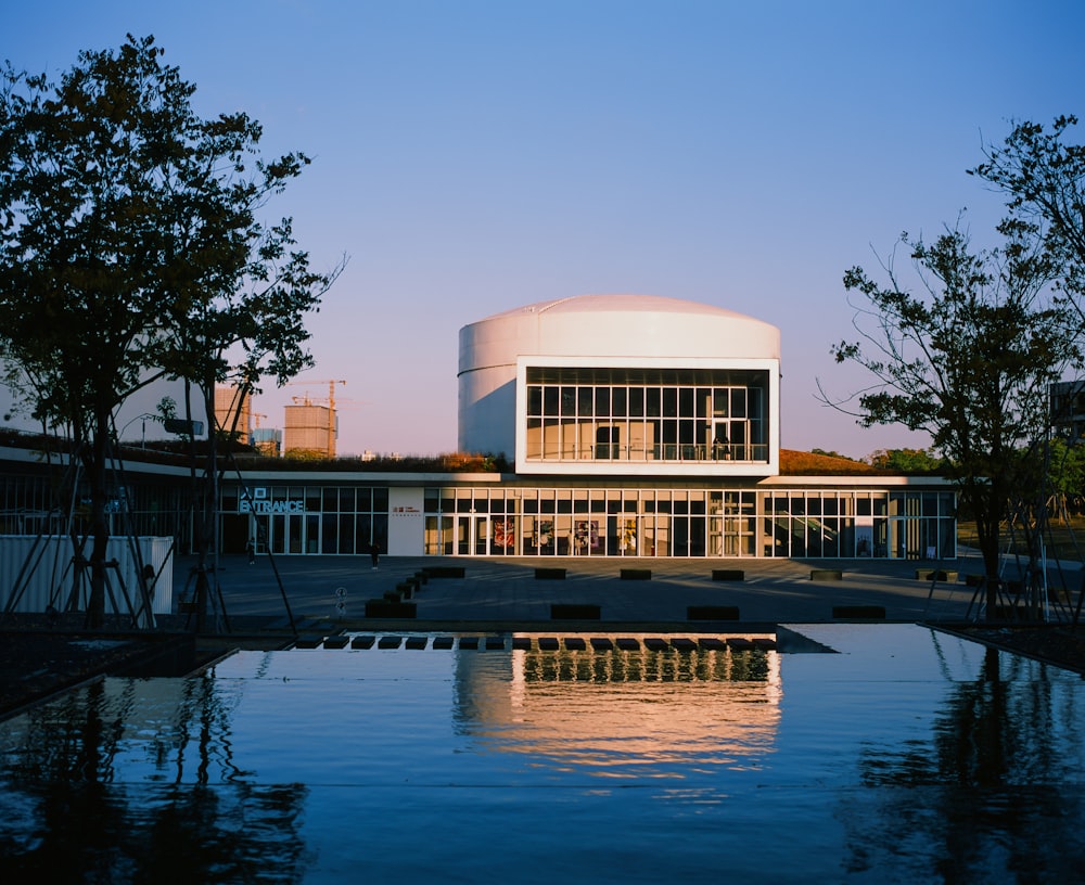 white concrete building near body of water during daytime