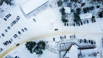 Wide shot of the parking area showing various vehicles stored safely for winter.