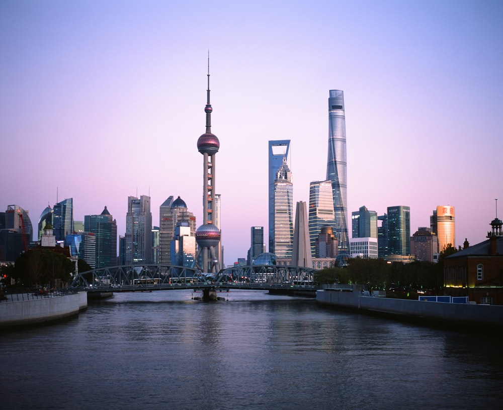 city skyline across body of water during daytime