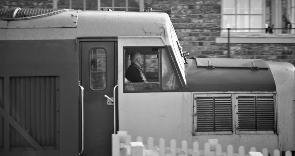 grayscale photo of train door