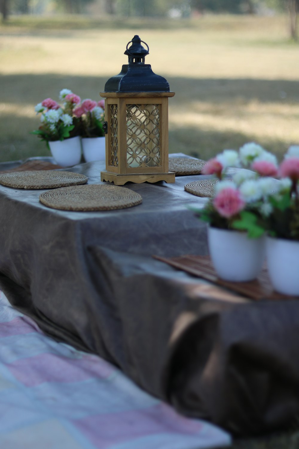 pink flowers on white ceramic vase