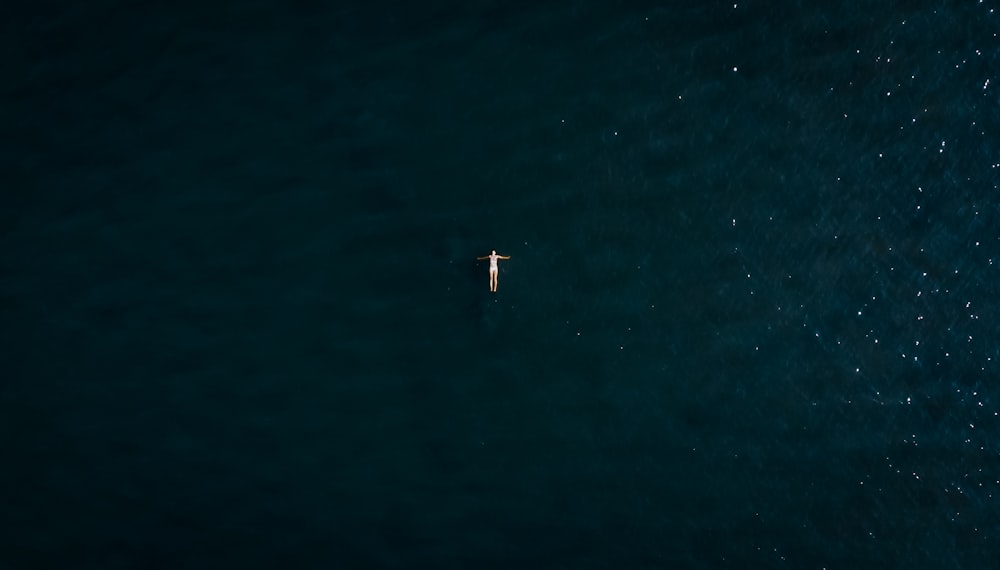 white boat on body of water during daytime