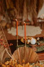 A peaceful altar with white and yellow candles glowing softly in a brown wooden setting.