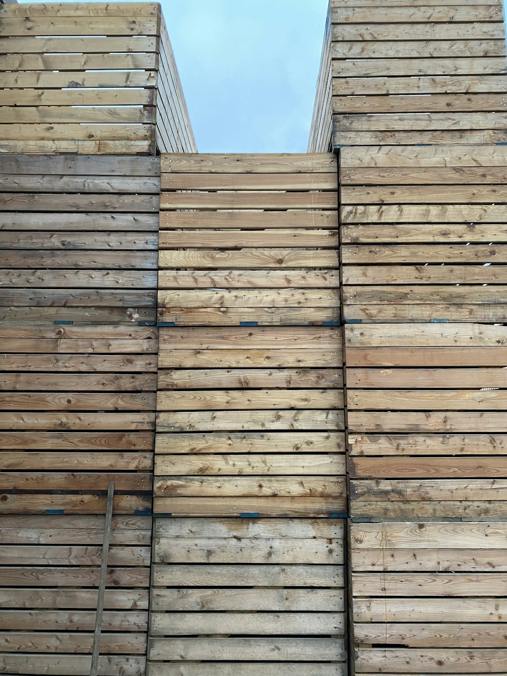 brown wooden wall under blue sky during daytime