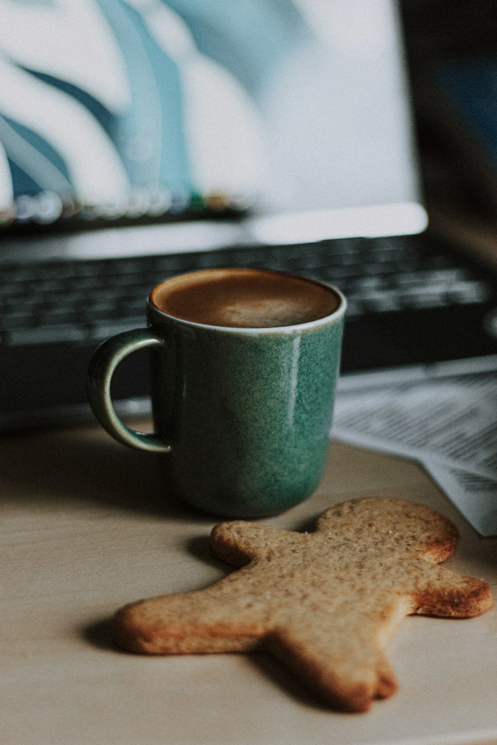 blue ceramic mug on brown coaster