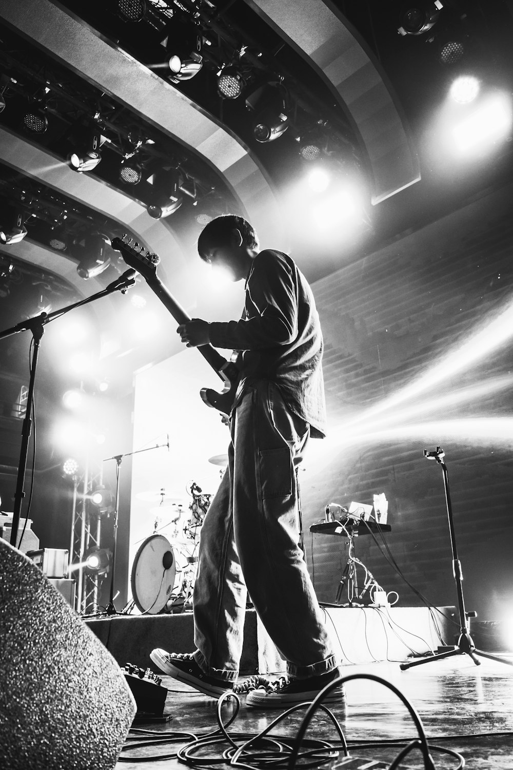 man playing guitar on stage