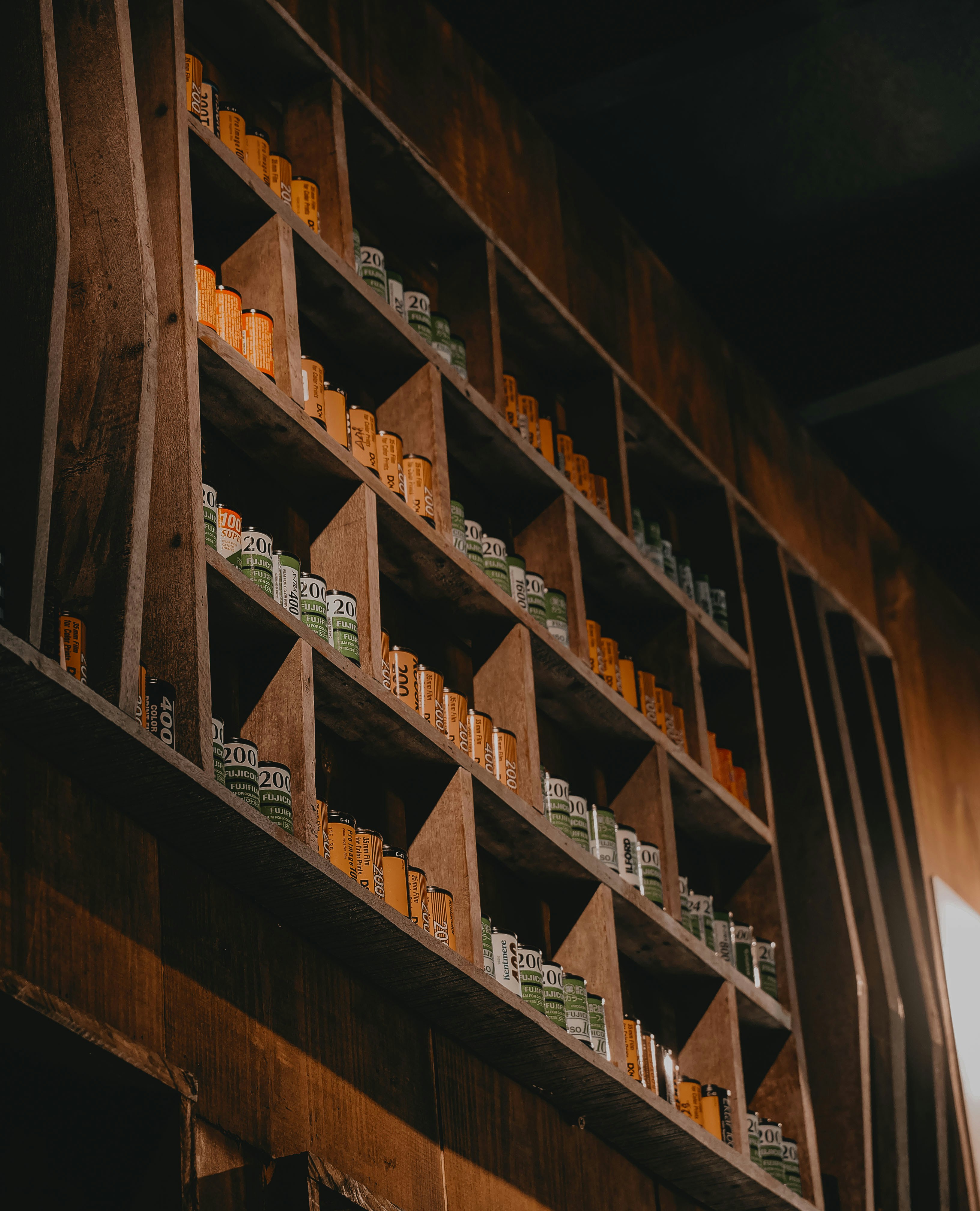 brown wooden shelf with books