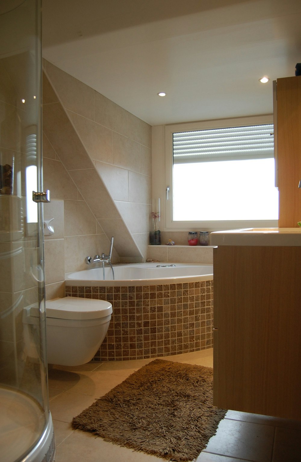 white ceramic bathtub near white ceramic bathtub