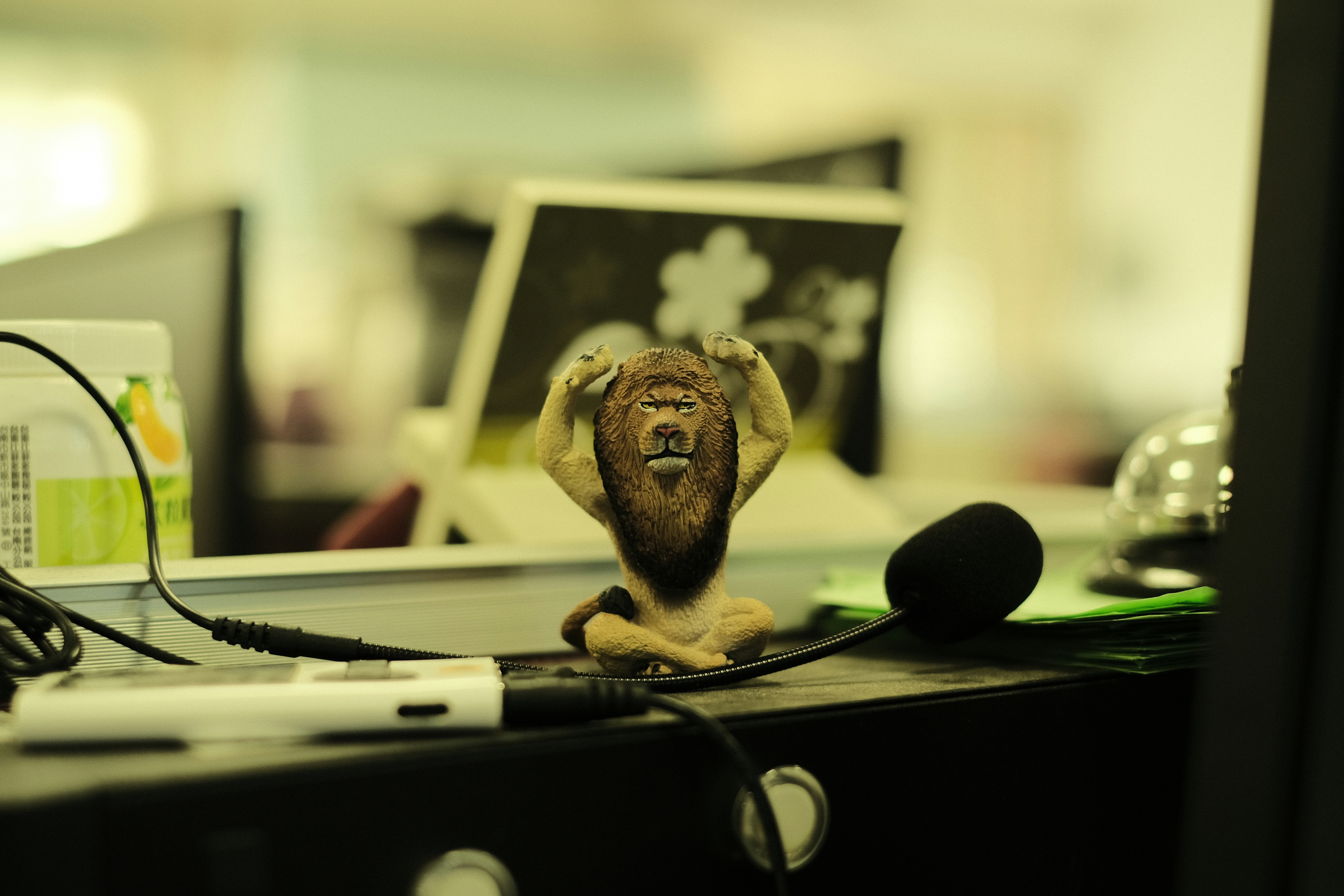 brown monkey plush toy on black table