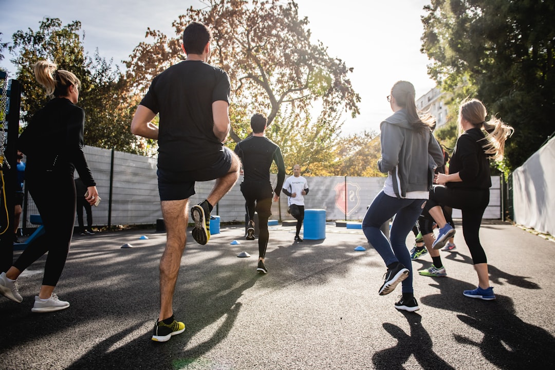 Group of adults exercising in a yard