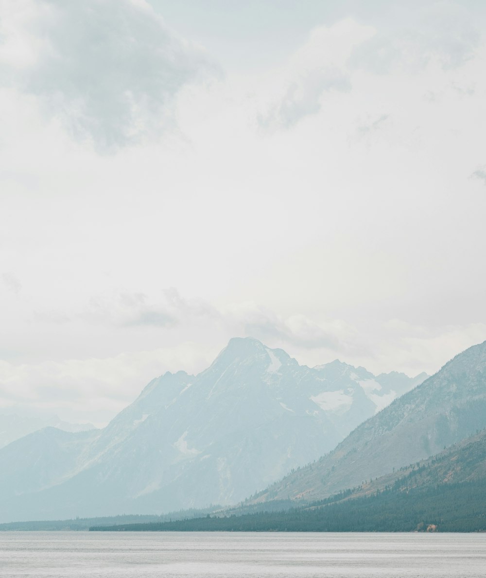 green mountains under white clouds during daytime