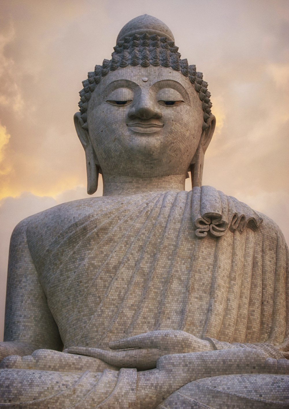 grey concrete statue under cloudy sky during daytime