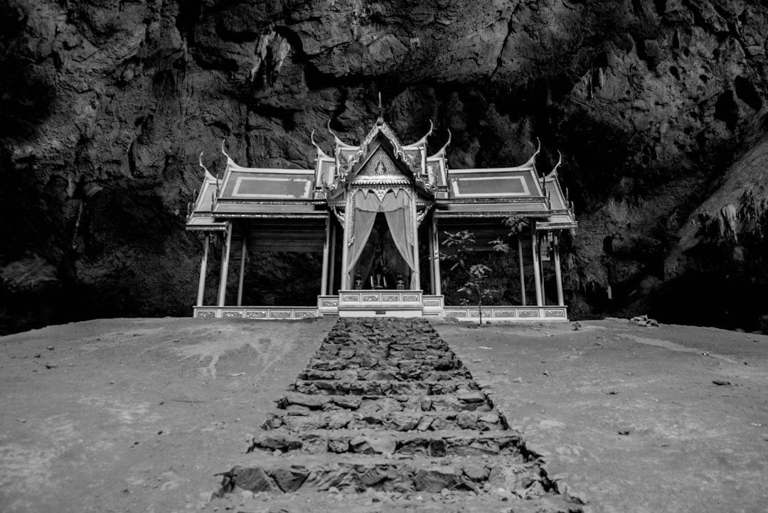 grayscale photo of concrete pathway