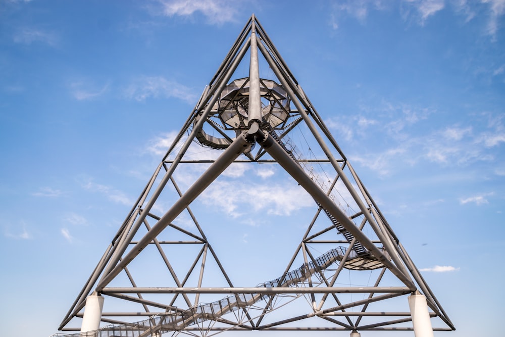 gray metal tower under blue sky during daytime