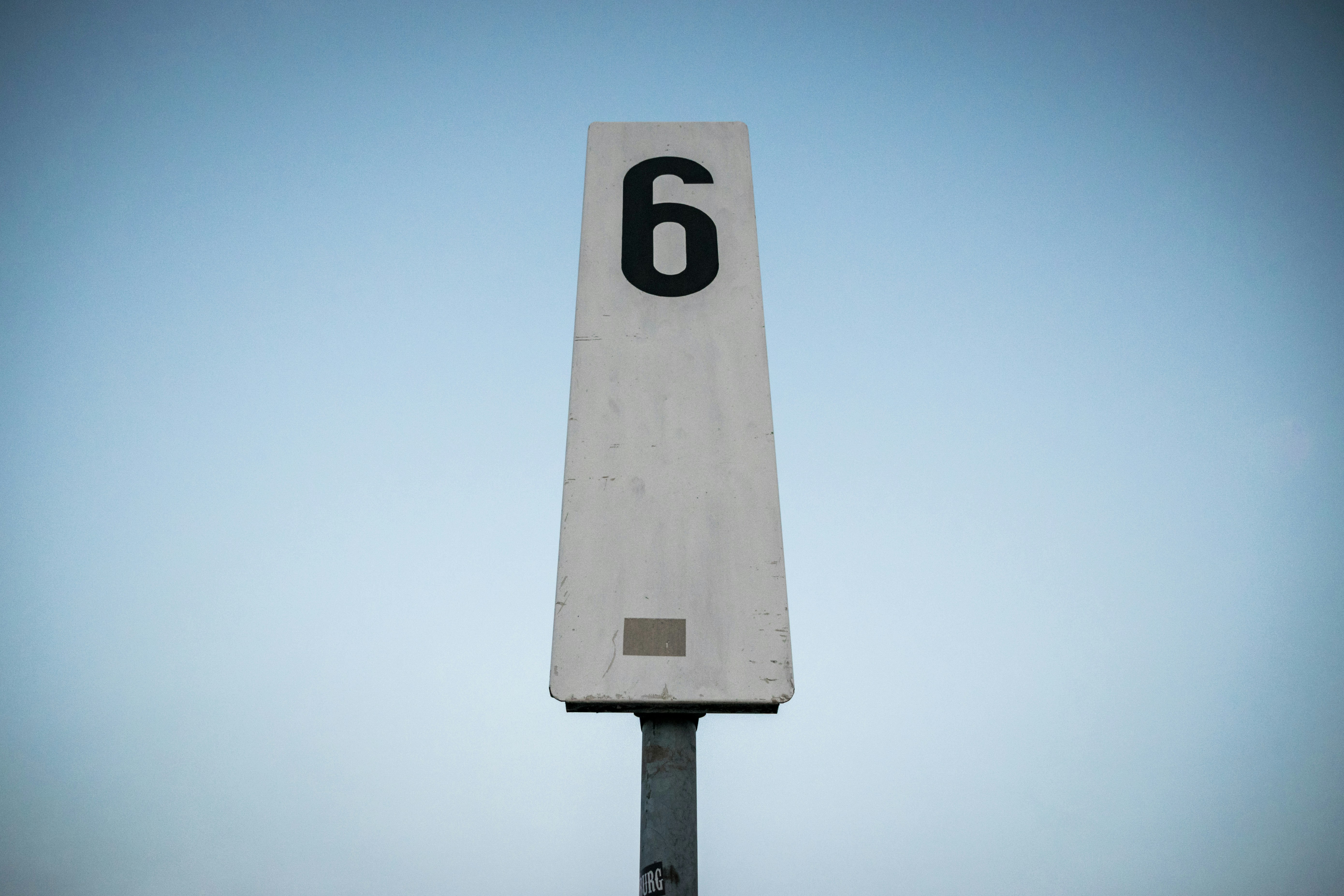 white and black p printed road sign