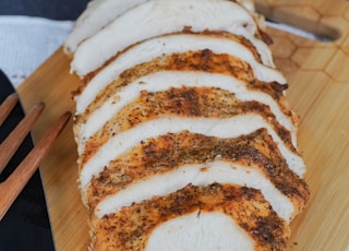 sliced bread on brown wooden chopping board