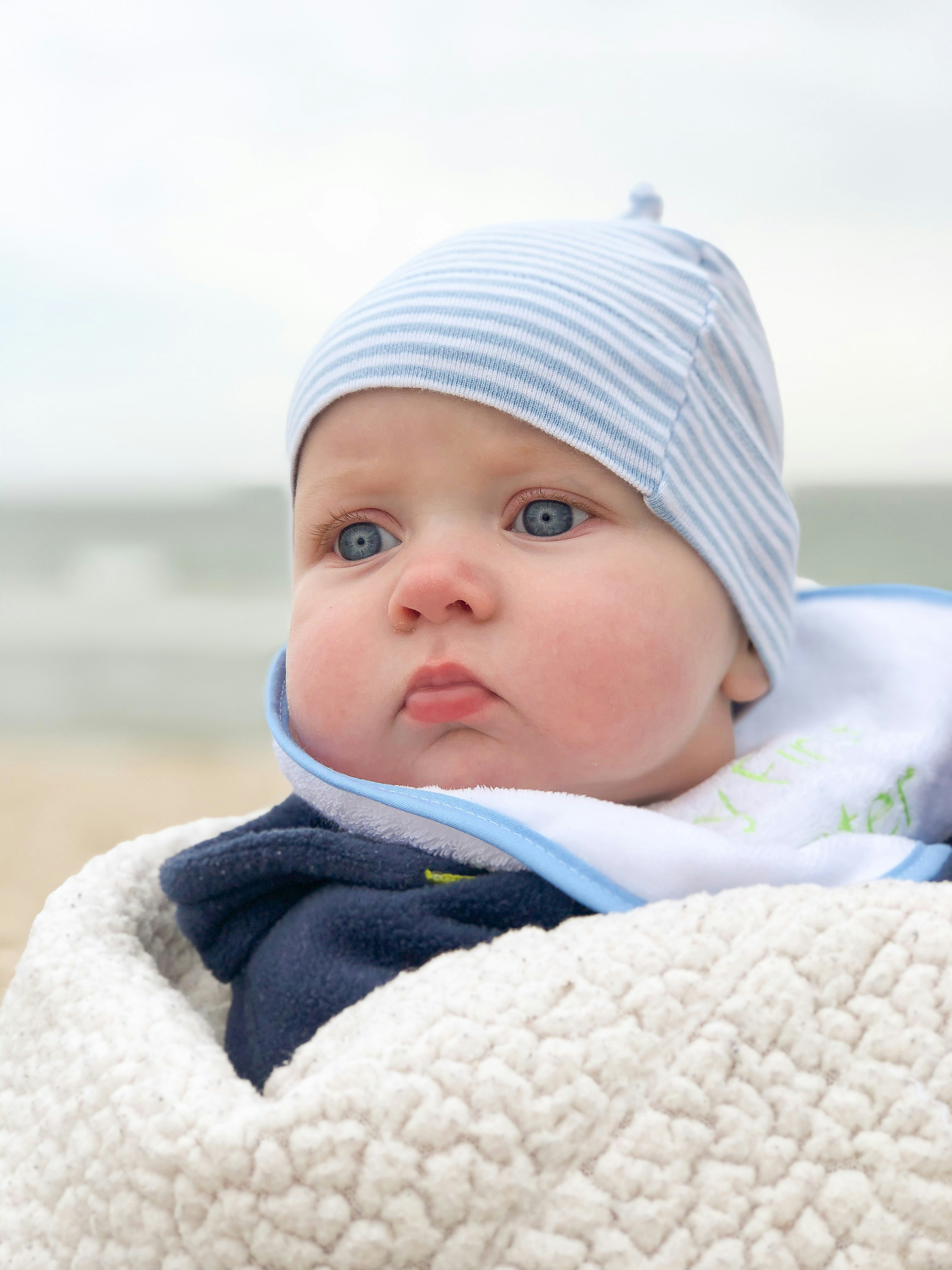 baby in white knit cap