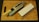 A kitchen knife with a beige handle rests on a sharpening stone, next to a whetstone on a wooden cutting board. The knife has multiple cutout holes in the blade.