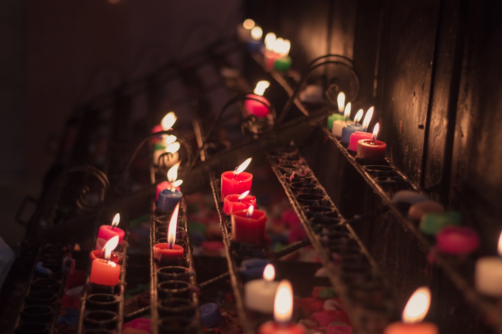 red candles on black metal rack