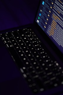 black laptop computer turned on showing blue screen