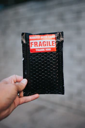 Close-up of a courier handling packages with care and professionalism.