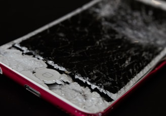 white iphone 5 c on black surface