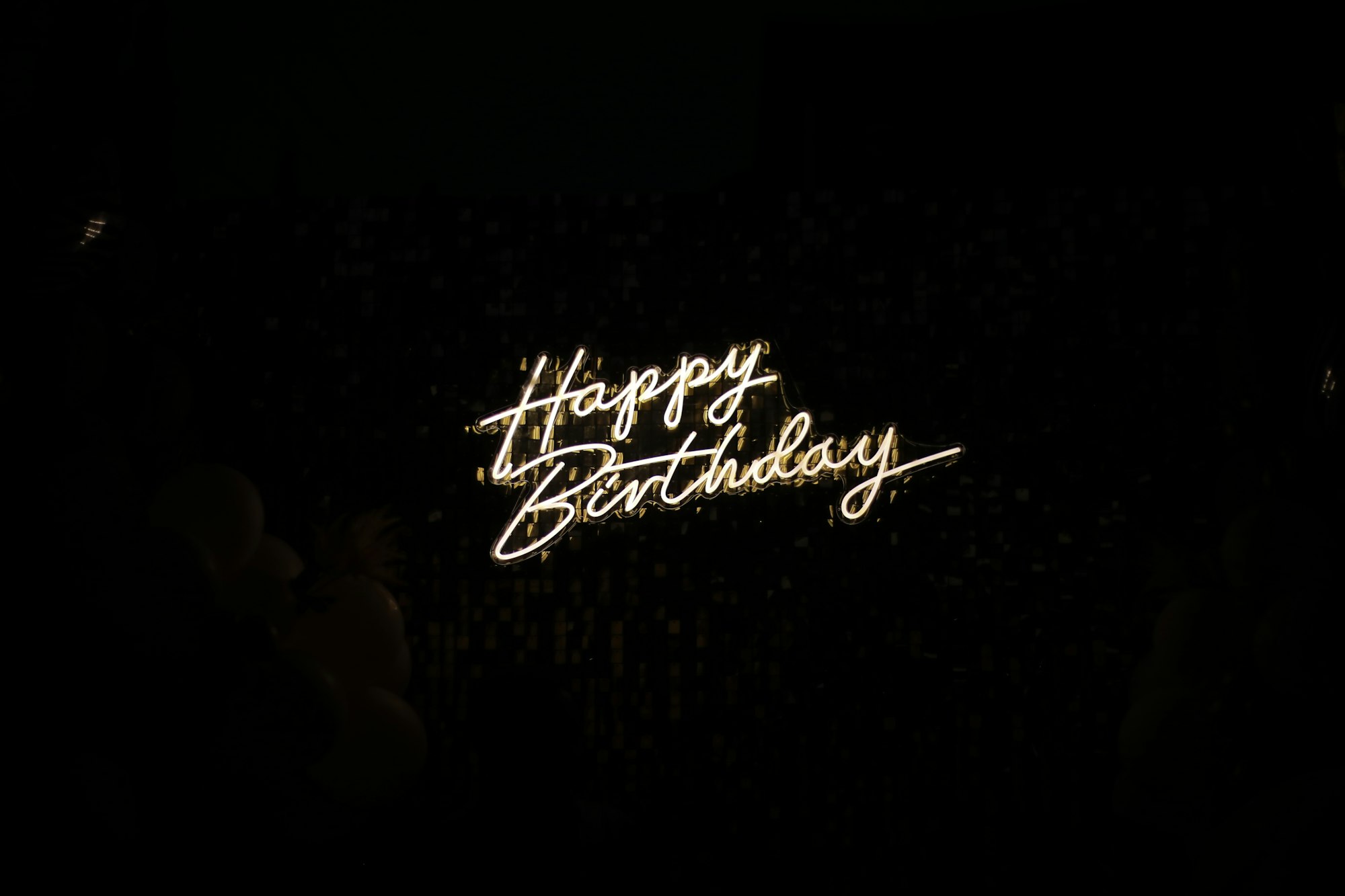 happy birthday written with neon lights