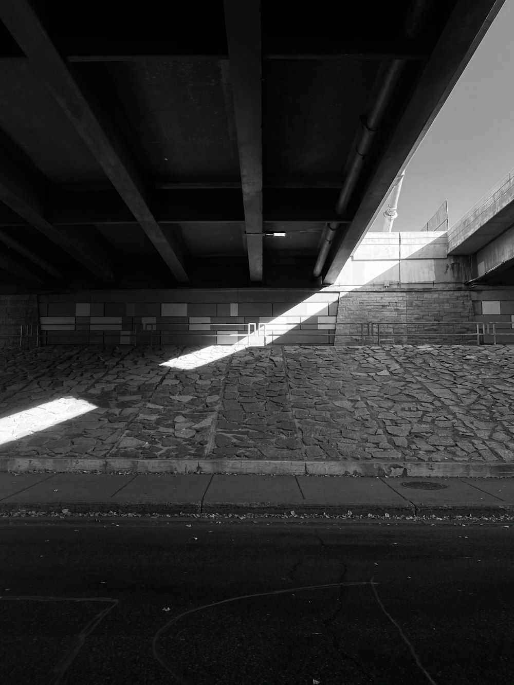 grayscale photo of empty tunnel