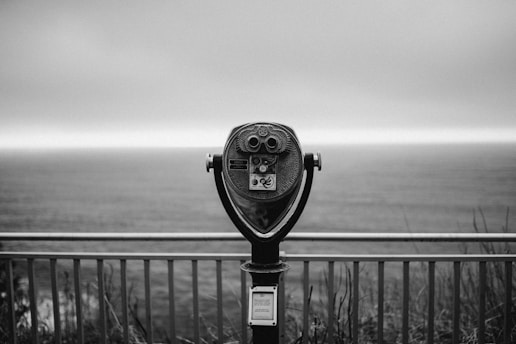 black and silver coin operated binoculars