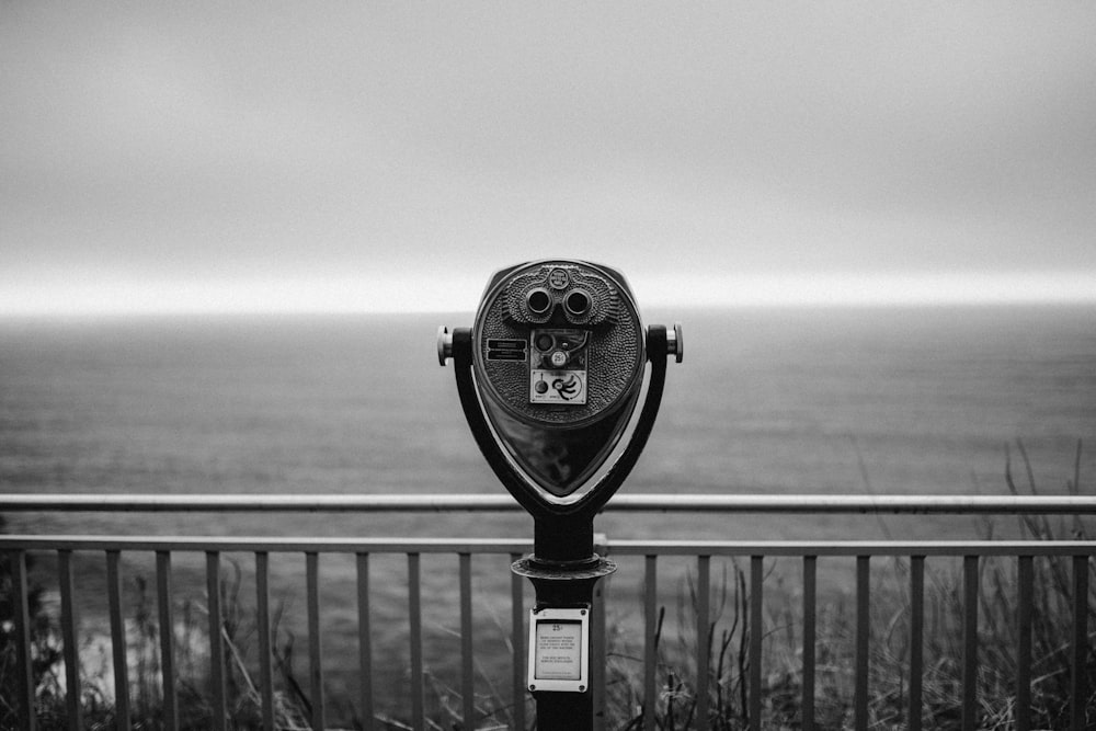 black and silver coin operated binoculars