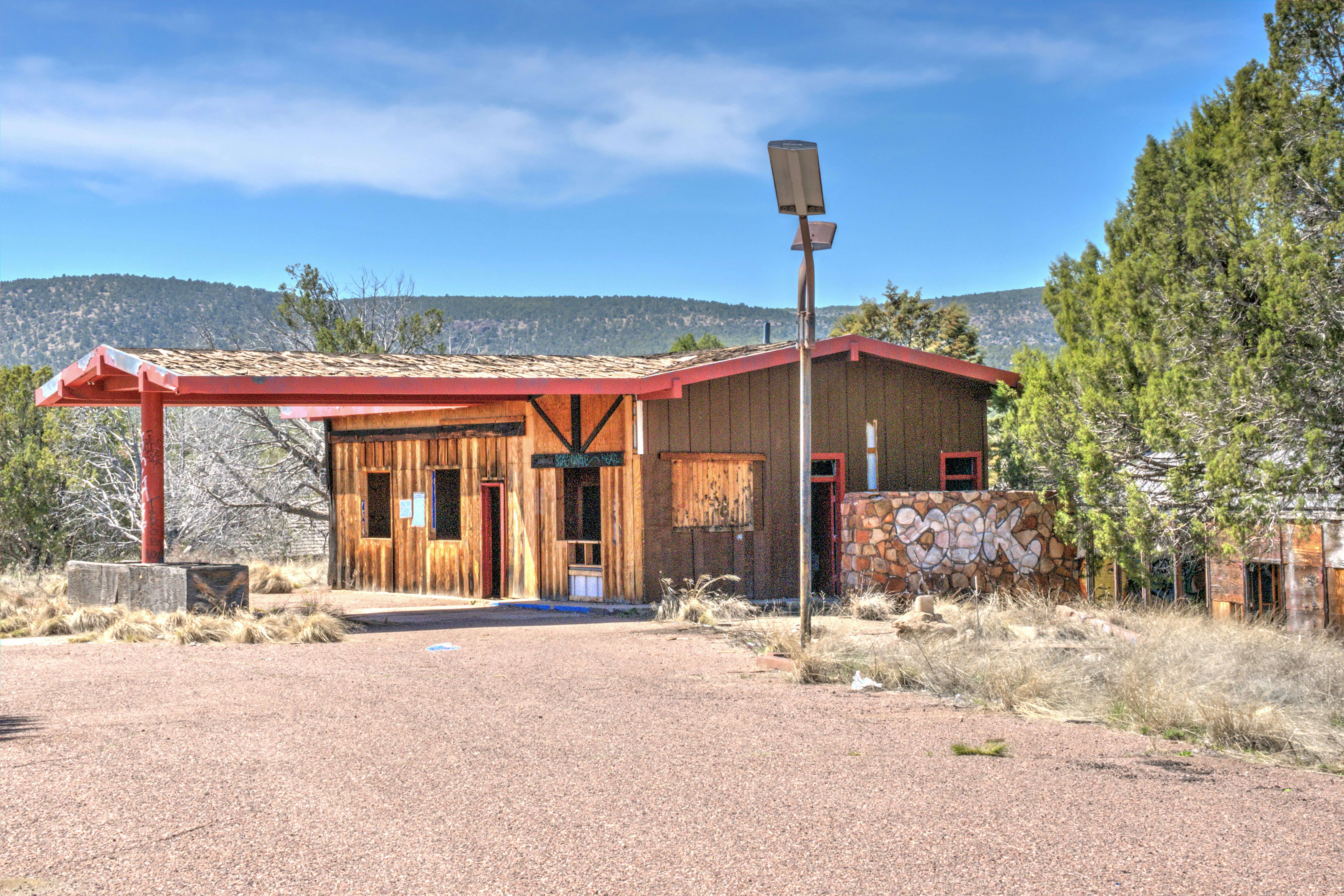 brown wooden house under blue sky during daytime