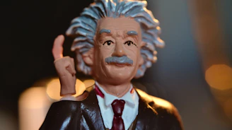 man in black suit jacket figurine