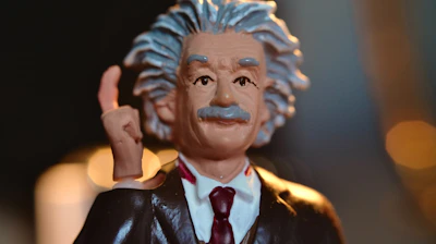 man in black suit jacket figurine