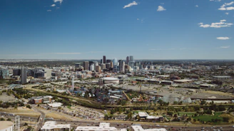 A vibrant panoramic view of Qiddiya City’s amusement parks under a clear blue sky.